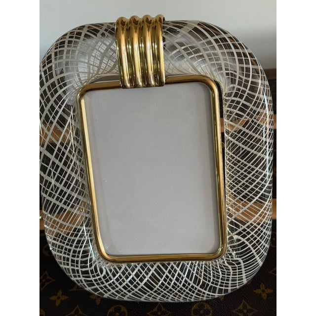This magnificent vertical photo frame is purely in the tradition of Venetian glassmaking. The technique used to achieve...