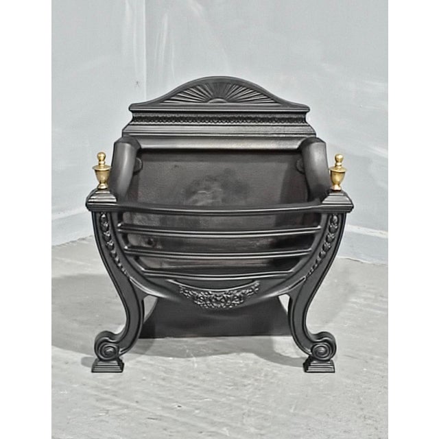 A very good antique grate, refurbished, brass finials, in very good verall condition. 25" high 21.5" wide 12" depth