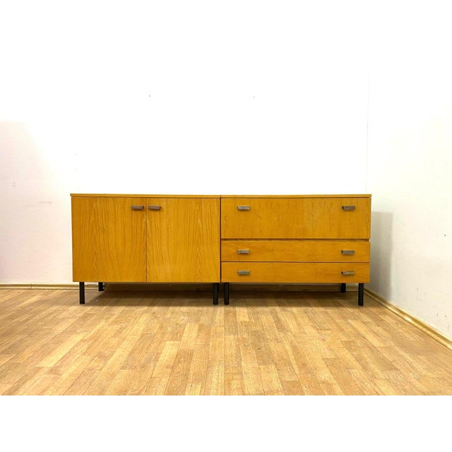 This set of retro cabinets was produced in Czechoslovakia during the late 1960s to early 1970s, a key manufacturer of...