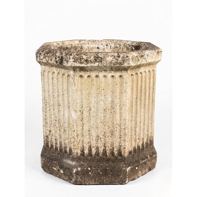 A distinguished and rare mid-century Neoclassical garden planter crafted from heavy cast stone. This piece is defined by...
