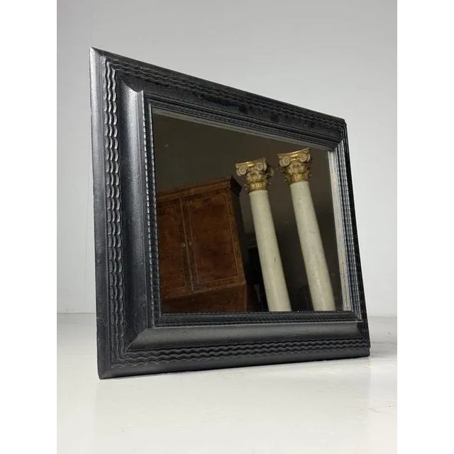 Vintage mirror with a black Ripple frame. 20th-century frame with a Ripple finish in good condition. We have fitted the...