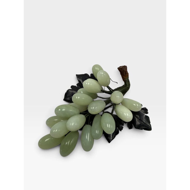 Introduce an air of elegant Chinoiserie luxury to your space with this authentic mid-century Chinese carved jade grape...