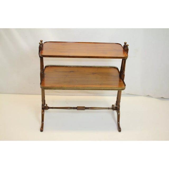 A very unique Regency maple dumbwaiter server side table, circa 1920s, with a brass label "OLD COLONY FURNITURE and SYMBOL...