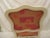 Bergere chair made in Italy with original orange floral upholstery in good condition. Chair has crack in top of the back...