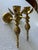 Elegant pair of vintage solid brass wall-mounted candle sconces featuring sculptural lotus flower cups and beautifully...