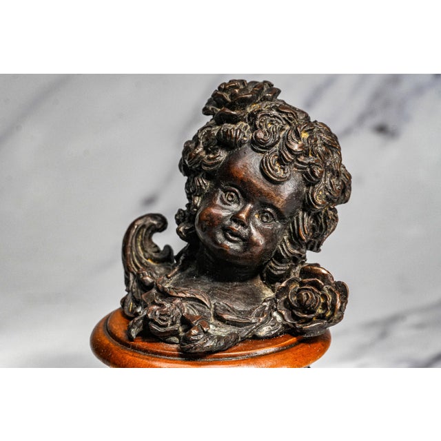 A delightful example of early 20th-century decorative art, this circa 1910 bronze cherub sculpture captures the timeless...
