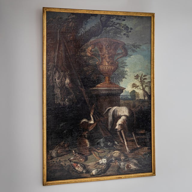Large-scale Baroque hunting still life featuring a centrally placed amphora set against an idealized landscape. The...
