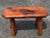 Mid-Century Modern live edge bench or table. We think this may be made of black walnut. Very nice design and easy size to...