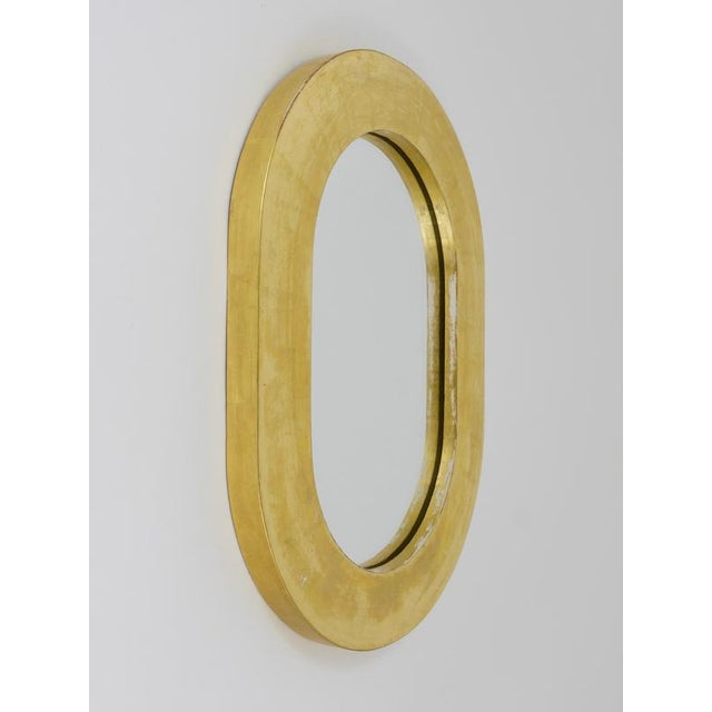 Beautiful Austrian modernist wall mirror. Designed and executed by Werkstätte Carl Aubock, Vienna/Austria. Made of gold-...