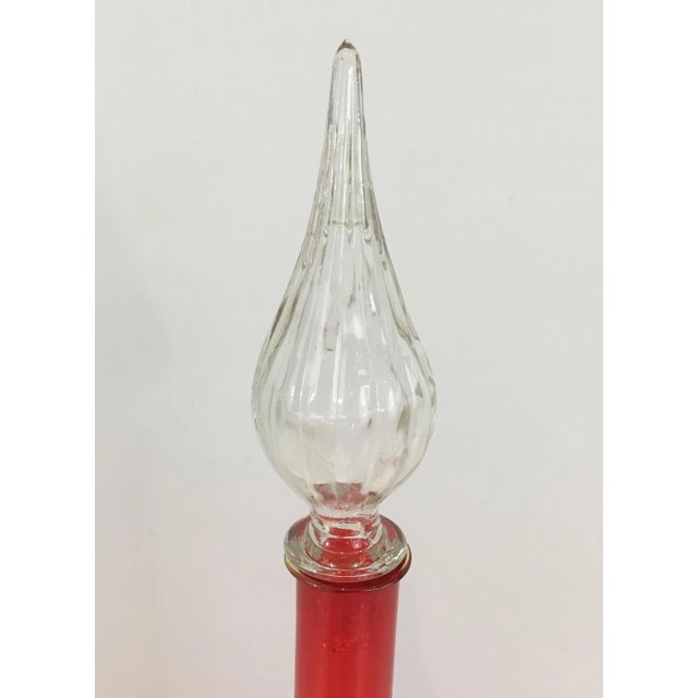 Red glass design bottle. Circa 1970.
