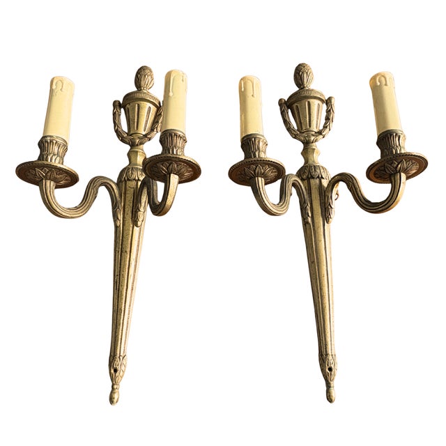 An elegant and unusually large pair of Louis XVI style gilt bronze sconces, finely cast and chiseled. Each sconce is...