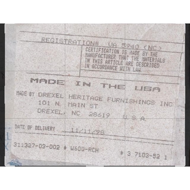 1998 high back Drexel Heritage ornate wicker rocking chair. Not the original cushion, I believe it was green checked....