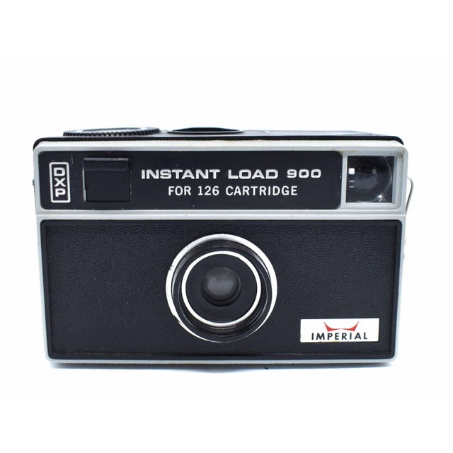 Capture a piece of mid-century Americana with this Imperial Instant Load 900, a classic point-and-shoot camera...