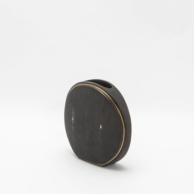 This exquisite vase by R&Y Augousti captures the essence of artisanal craftsmanship with its luxurious shagreen surface,...