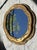 Mid-century Italian Baroque-style wall mirror, beautifully hand-carved and finished in original gilt. The design reflects...