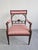 In this listing you will find a gorgeous French Empire style armchair done in mahogany and upholstered in striped fabric...