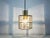 A Mid-Century Modern pendant lamp by Glashütte Limburg made in the 1960s in Germany. It is fascinating with its beautiful...