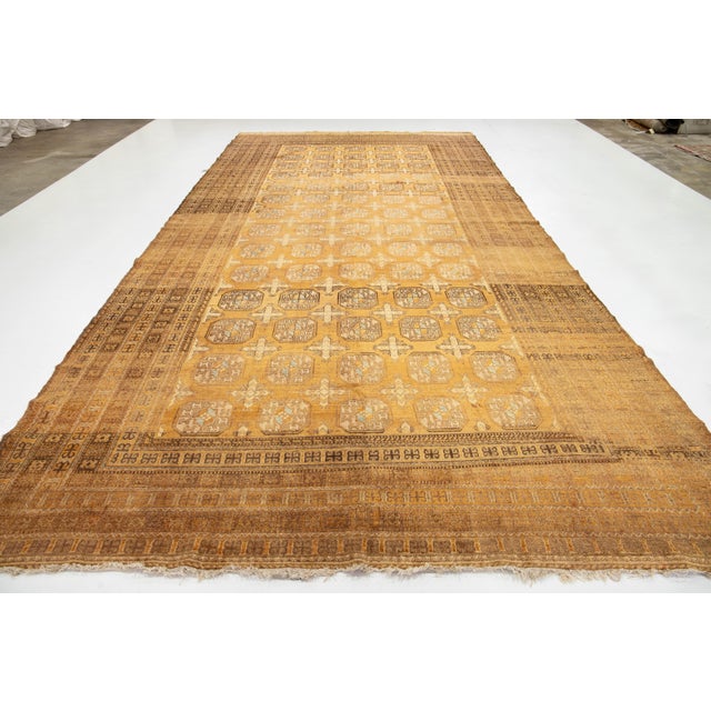 Persian 9 X 17 Antique Turkmen Handmade Tan Persian Wool Rug With Gul Motif For Sale - Image 3 of 10