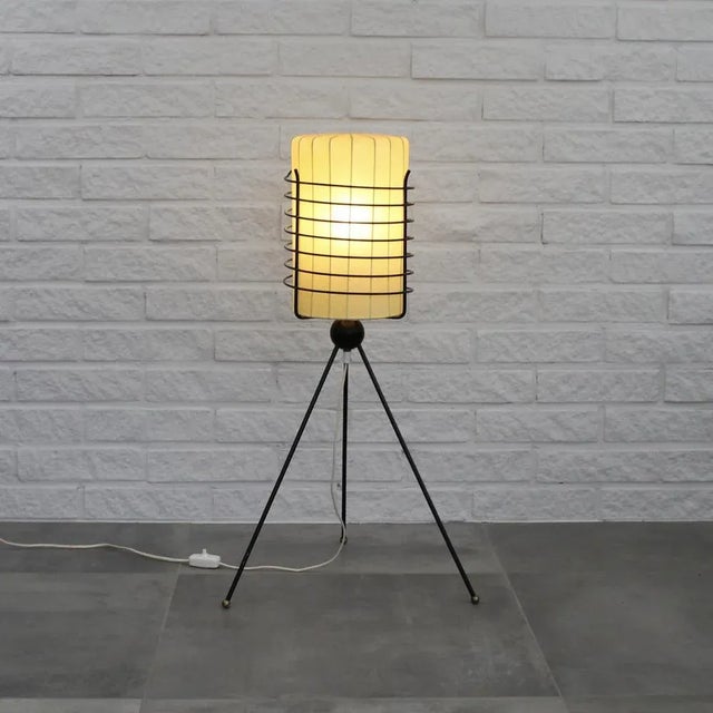 Rare mid-century Swedish floor lamp produced by Trema Industri, c. 1958. The lamp features a metal tripod base with a...