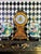 Oversized decorative mantel clock by Castilian Imports in an Italian Florentine style. The sculptural case features hand-...