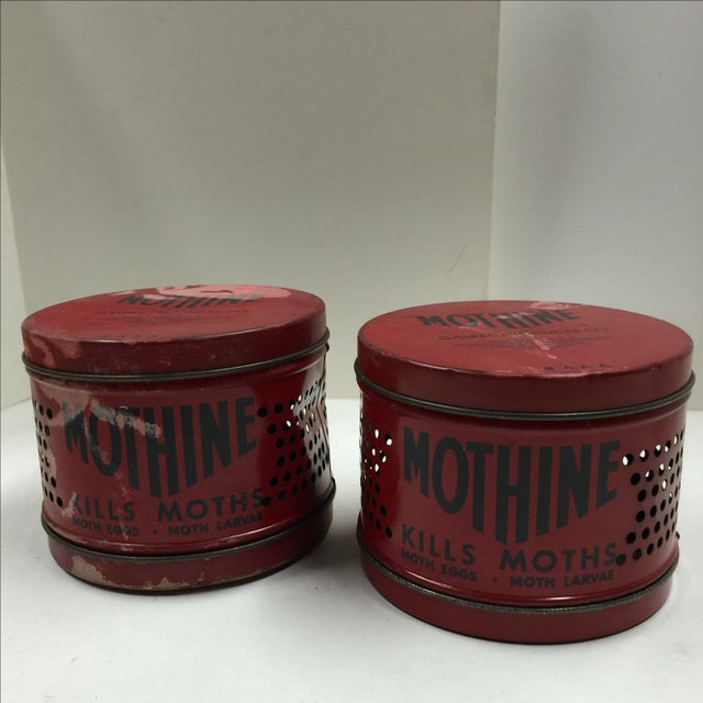 Great decor items! A pair of vintage red Mothine tins.