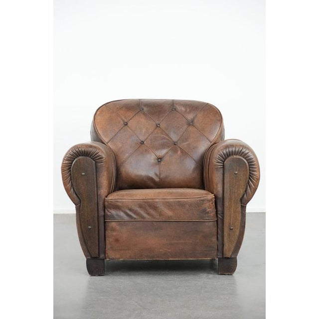We are pleased to offer this exceptional and wonderfully comfortable antique sheepskin armchair, featuring a luxurious...