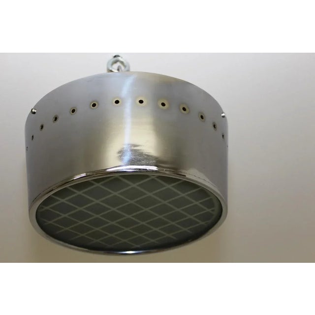 This chrome-plated brass ceiling lamp is equipped with two E27 sockets. It features an inlaid glass plate with etched...