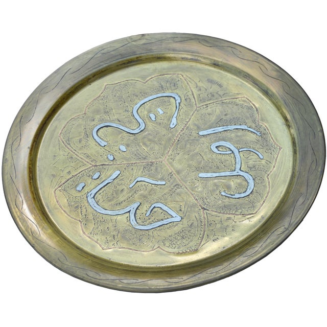 Antique Moroccan tray exceptionally handcrafted of solid brass using simple tools, featuring hand-engraved and ornate...