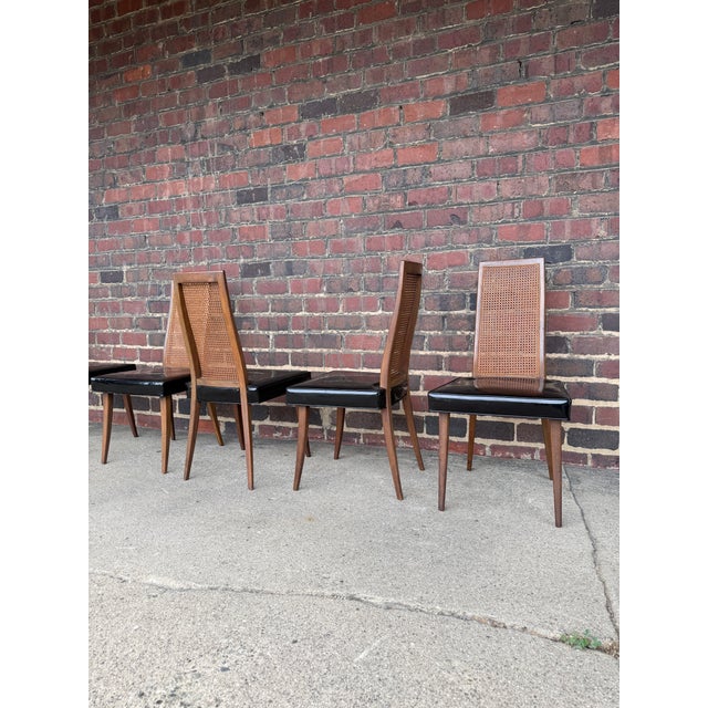 Great set of six chairs by Harvey Probber the lines on these are great and all the caning is in tacked.