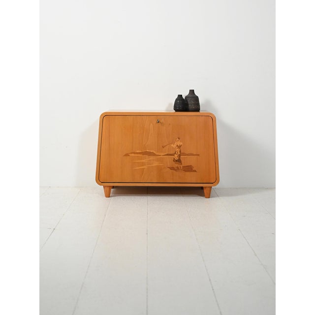 Rare 1940s Scandinavian inlaid elm cabinet; keyed drop-leaf door, interior with shelf and compartments, organic trapezoid...