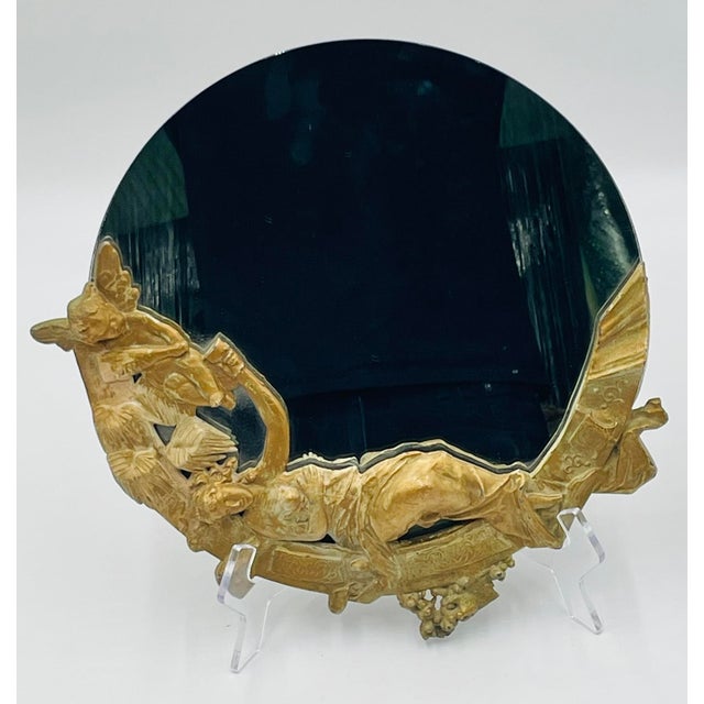 An exquisite French Victorian gilt bronze vanity table mirror, richly sculpted and signed PH. MARTIN, a name associated...