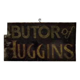 Salvaged Remnant Antique Hand Painted Wood Trade Sign Advertising "Distributor of Huggins" For Sale
