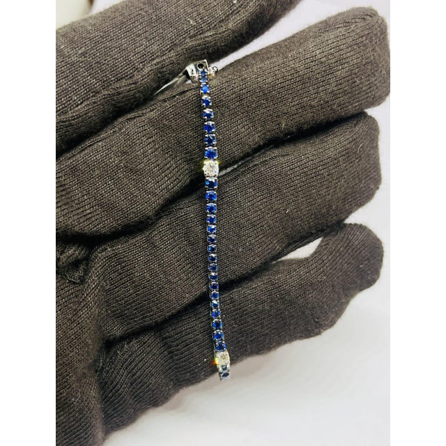 GEMSTONE DETAILS Gold Purity: 18K Solid Gold (stamped) DIAMOND: 0.45 CTS SAPPHIRE: 2.74 CTS 18K GOLD GROSS WEIGHT: 8.03...
