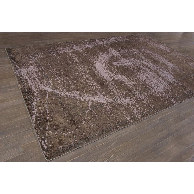Vintage hand-knotted Overdyed rug with a medallion floral motif. This piece has great detailing and a beautiful design. It...