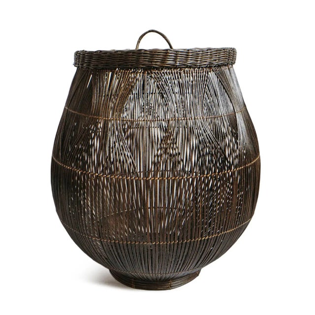 Large coffee stained rattan basket with interesting woven pattern. Includes lid. 16.5" opening at top. Each basket may...