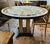 French Grand French-Style Round Dining Table – Ornate Marble Top With Gilded Columns & Black Base For Sale - Image 3 of 4