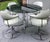 This space-age chrome and white vinyl dining set from groovy MCM brand Cal-Style is comfortable, functional, and gives off...