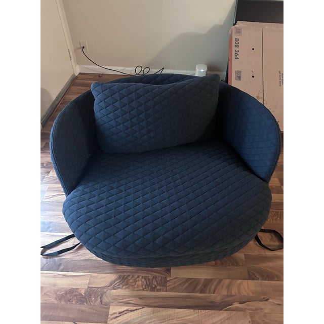 The Bart has a substantial rounded silhouette with a fully upholstered frame, generously padded seat, and loose back...