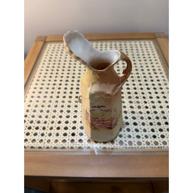 Porcelain ewer production flourished in the 19th century, with many European factories creating decorative and functional...