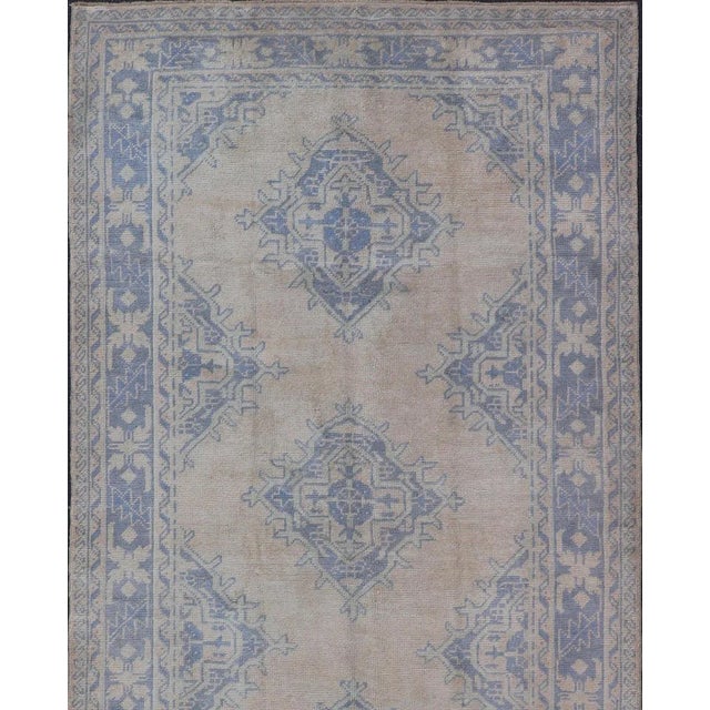 Measures: 5'0 x 12'5 Turkish Oushak Gallery Rug in Muted Blue and Cream with Geometric Design. Country of Origin: Turkey;...