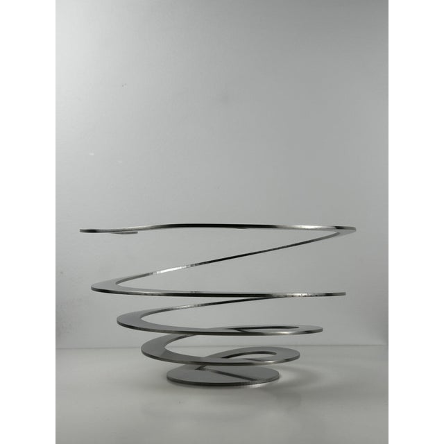 A bold statement piece for any design-conscious home — the Spiral Fruit Bowl by Jacob Borch for Excel Denmark is a...