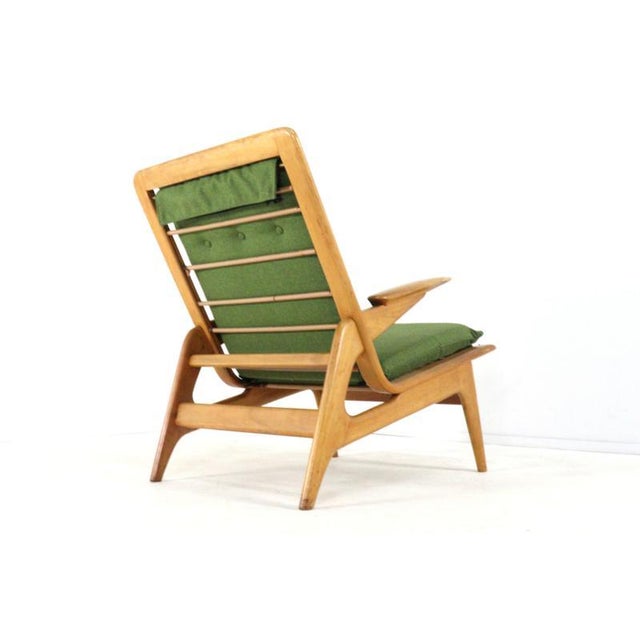 This mid-century armchair is a beautiful example of timeless design where form and comfort come together effortlessly. The...