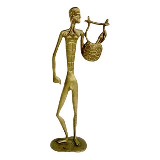 Mid 20th Century Brutalist Cast Brass Etruscan Figure of Man With Basket For Sale
