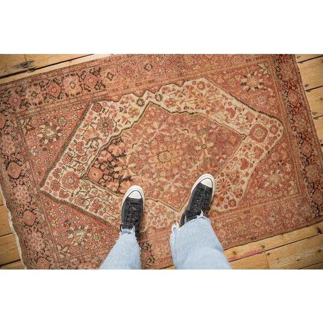 :: Oversized shield-like center medallion with interior floral palmettes in alternating pinwheel coloration adorned by...