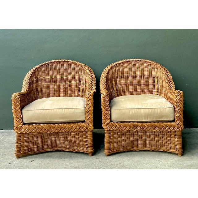 This elegant pair of vintage braided rattan lounge chairs exemplifies the effortless charm and relaxed sophistication of...