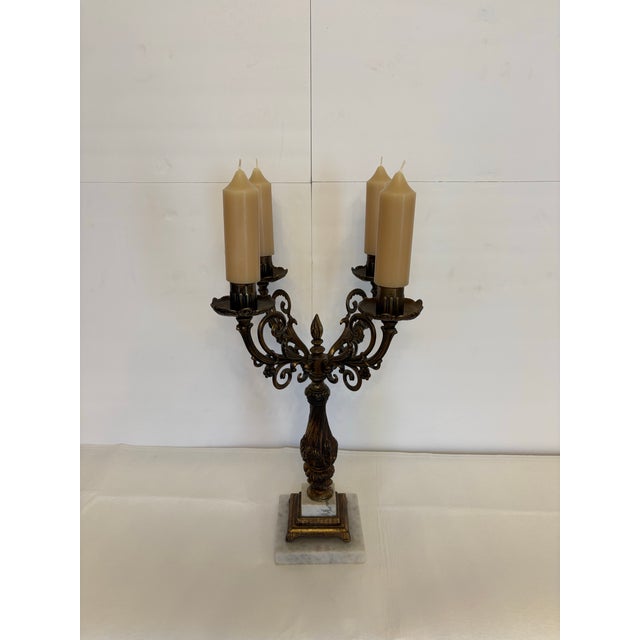 This Rococo Revival style cadleabra is characterized by its heavily detailed scrollwork, twisting center column and...