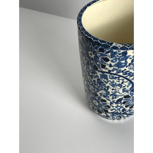 finely preserved example of early 20th-century English blue and white pottery, this Staffordshire transferware vase...