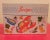 Metal recipe box, excellent condition. Bright colored graphics and stamped OHIO ART. Main feature cooking utensils,...
