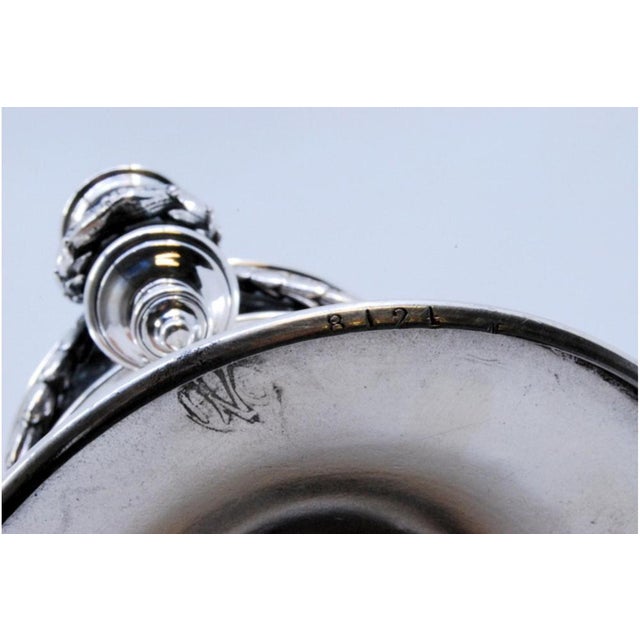 Silver Perfume Bottle with Round Base and Cord Application, in Very Good conditions. Designed 1920 to 1949 This piece has...