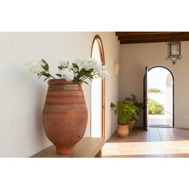 A monumental piece of Mediterranean daily life, this large storage jar often associated with the Biot region of France or...
